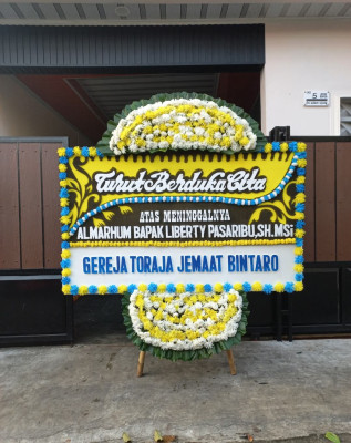Papan Bunga Duka di 36 Ilir